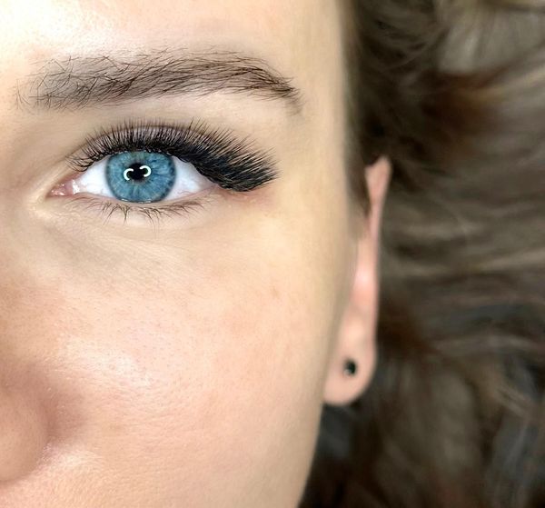 Volume lash extensions on blue eyes